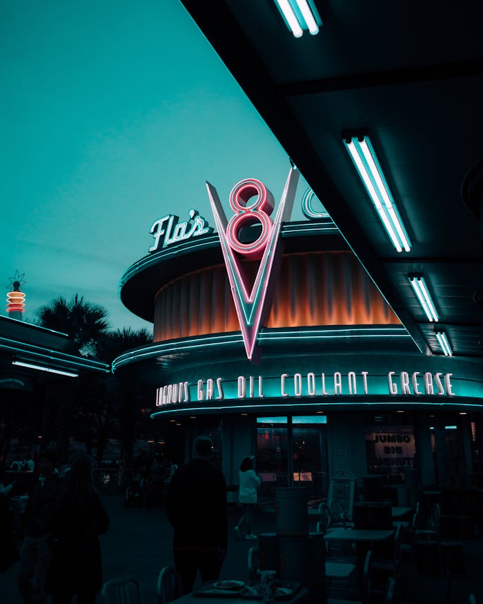 Illuminated Flos V8 Cafe in Cars Land at Disney California Adventure Park, Anaheim, California, USA